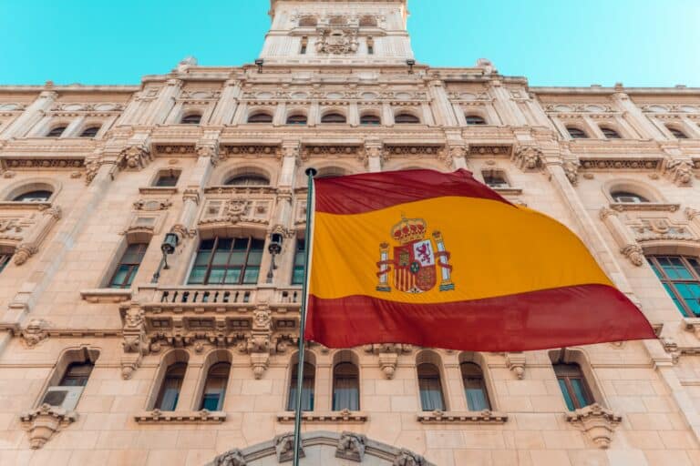 Flag of Spain in front of building