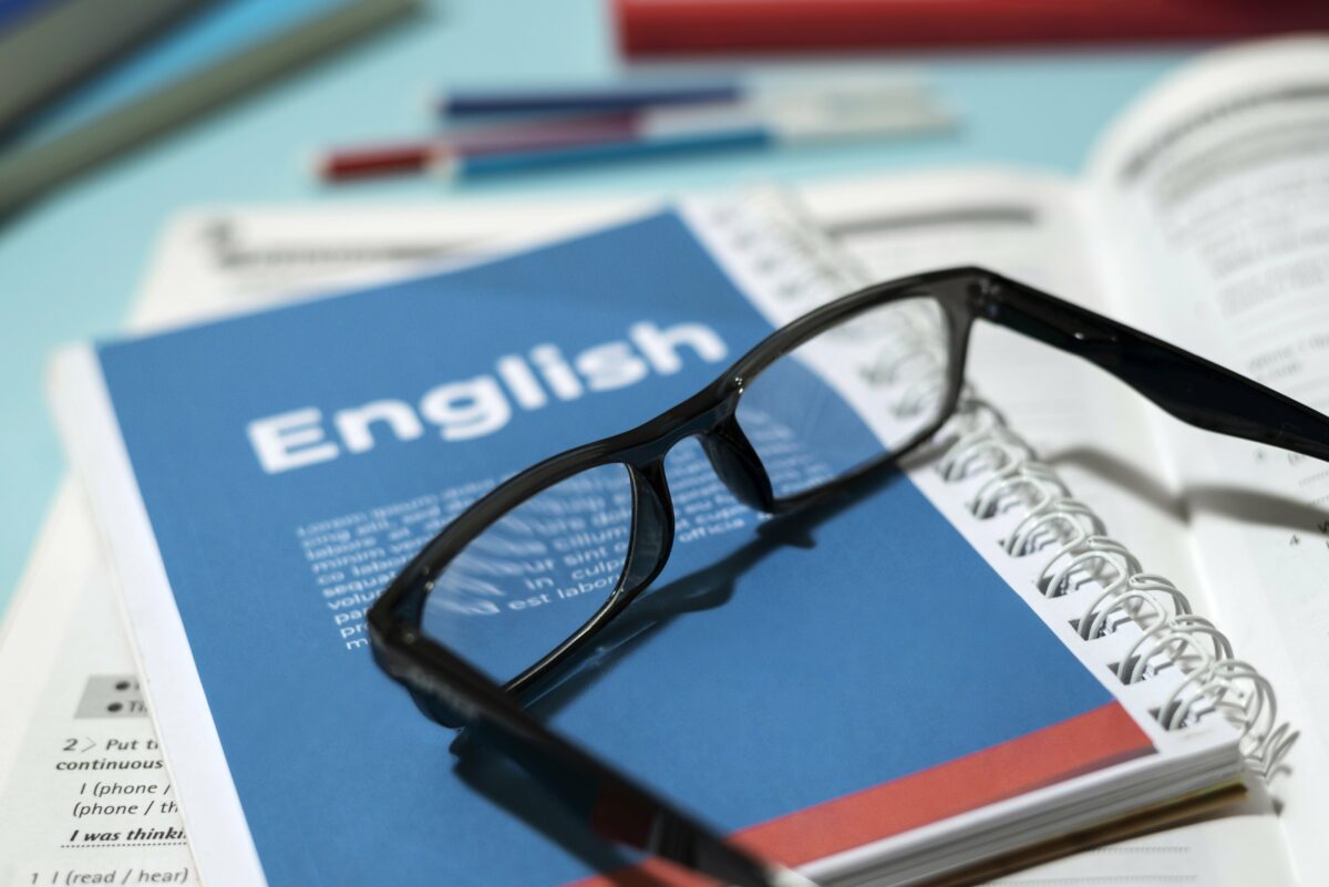English book with glasses on it